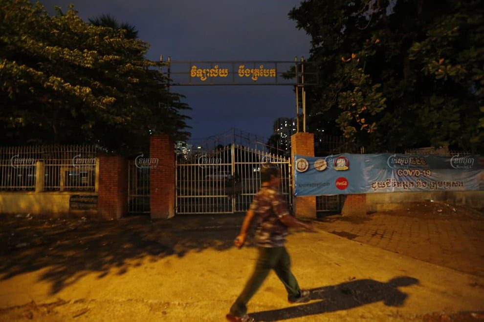 A man walks cross Boeng Trabek High School in Phnom Penh on November 8. Panha Chhorpoan