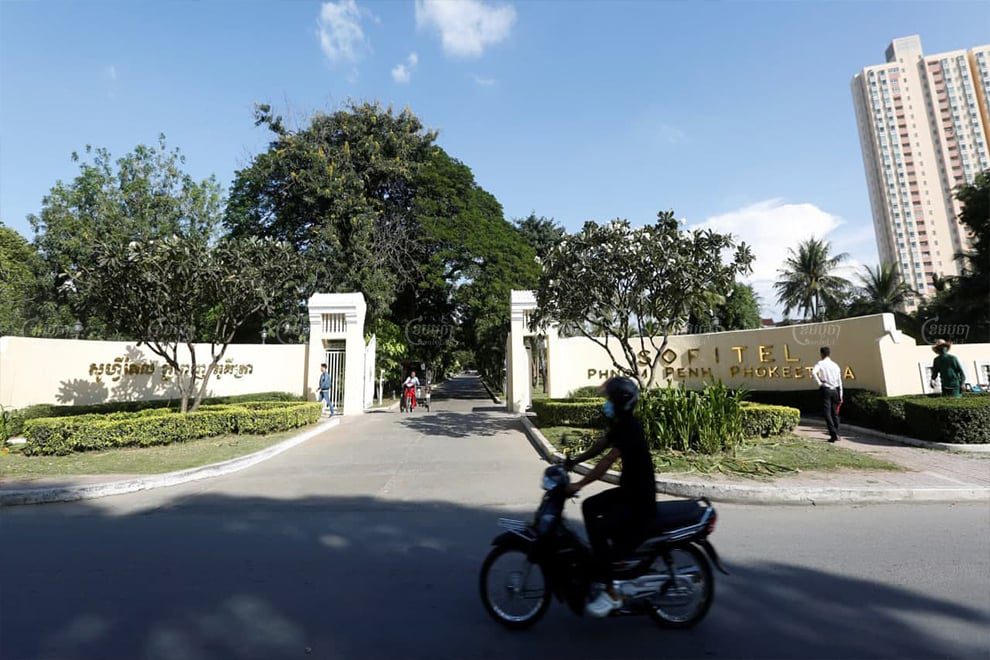 A motorist rides past the Sofitel Phnom Penh Phokeethra on Wednesday in Phnom Penh's Chamkarmon district. Panha Chhorpoan