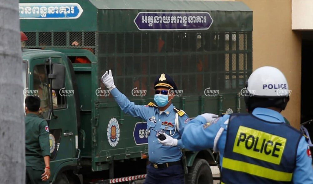 Defendants arrive at the Phnom Penh Municipal Court on Thursday ahead of hearings in widely condemned trials of members and affiliates of the outlawed Cambodian National Rescue Party. Panha Chhorpoan