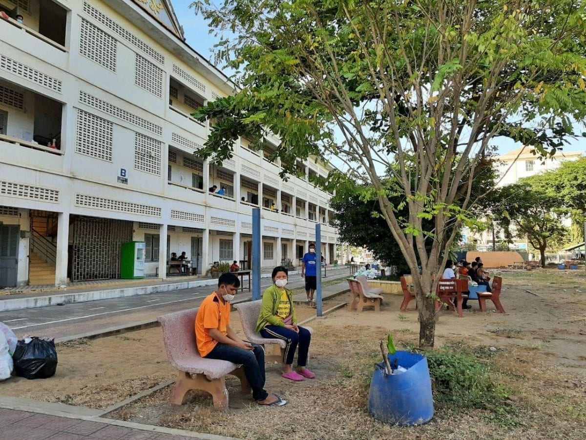 Cambodian migrant workers returning from Thailand are quarantined at a high school in Battambang province in a photo posted to the provincial administration's Facebook page.