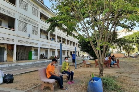 Cambodian migrant workers returning from Thailand are quarantined at a high school in Battambang province in a photo posted to the provincial administration's Facebook page.
