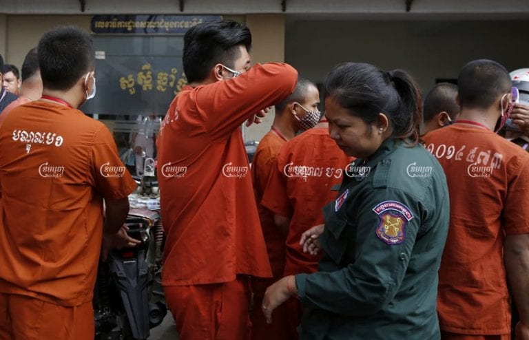 Prisoners arrive at Phnom Penh Municipal Court ahead of their trials on June 2020. Panha Chhorpoan