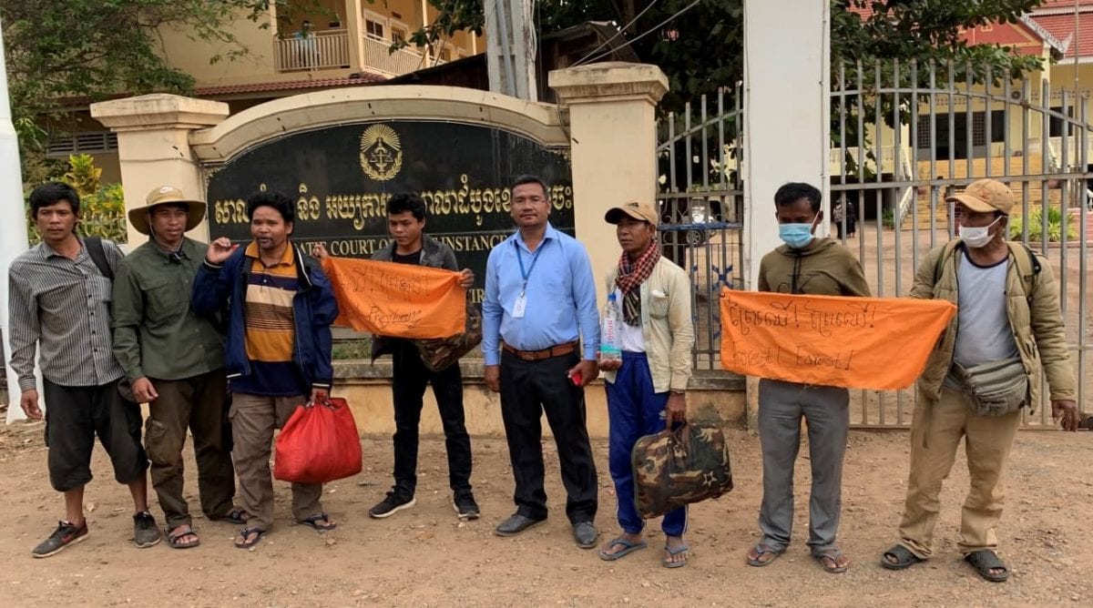 The five activists stand outside the Kratie Provincial Court with rights monitors and supporters, shortly after they were released Monday morning. Adhoc