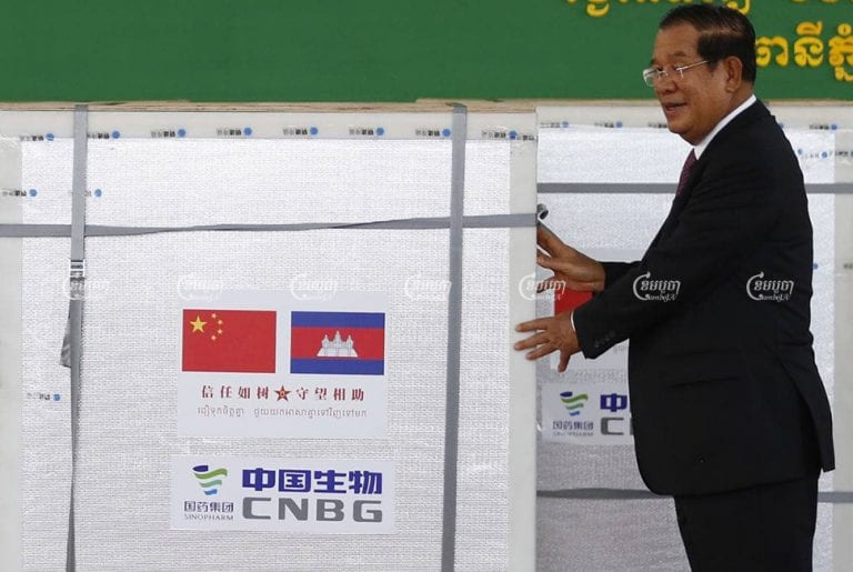 Prime Minister Hun Sen accepts the first consignment of the Chinese-made Sinopharm vaccine in Phnom Penh last month. CamboJA/Pring Samrang