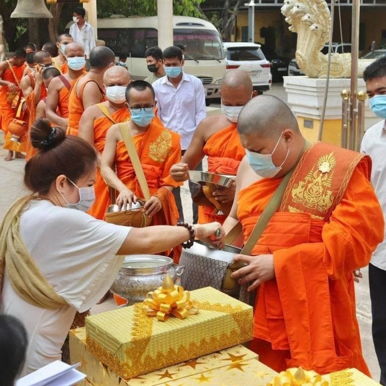 Duong Chhay stands in line to receive alms, in this photo posted on his Facebook page on Sunday.