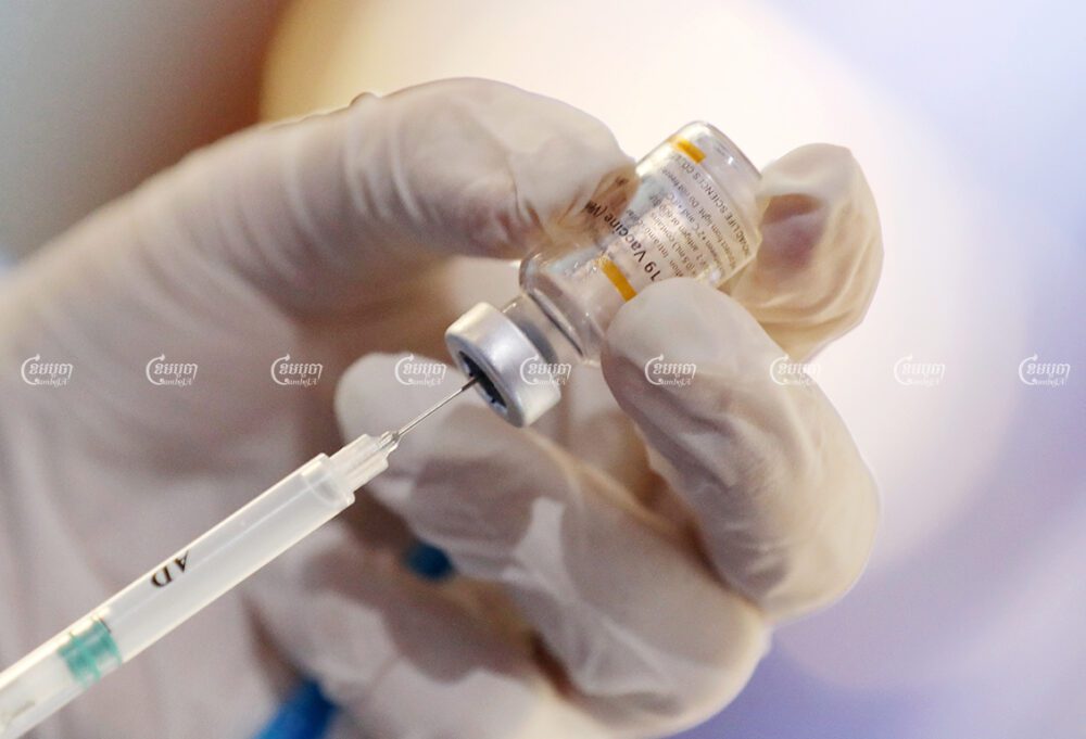 A healthcare worker prepares a dose of the Chinese-made Sinovac vaccine during Cambodia's ongoing COVID-19 vaccination campaign in Phnom Penh, April 1, 2021. CamboJA/ Pring Samrang