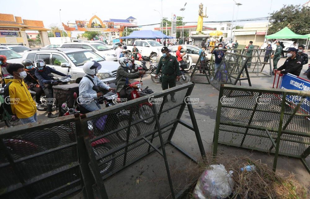 Authorities block the street at the border of the Phnom Penh and Takhmao City, Kandal, on the first day of lockdown , April 15, 2021. CamboJA/ Pring Samrang