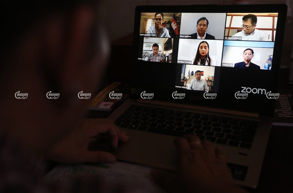 A woman watches the livestream of an online panel discussion over Zoom to commemorate World Press Freedom Day, May 3, 2021. CamboJA/ Pring Samrang