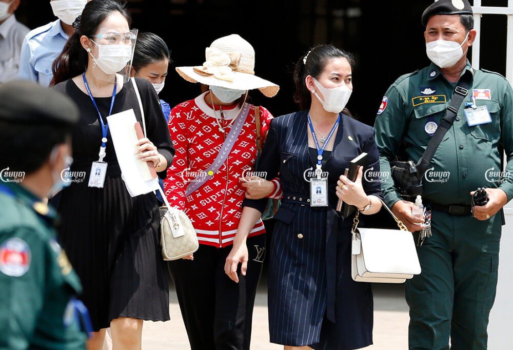 Lawyers and the mother of Mean Pich Rita leave Phnom Penh Municipal Court after signing the bail guarantee for her release, May 13, 2021. CamboJA/ Panha Chhorpoan