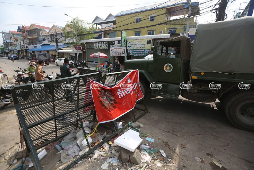 Military trucks bring food supplies for distribution to residents who live in a red zone in Stung Meanchey 3 commune in Phnom Penh, May 12, 2021. CamboJA/ Pring Samrang