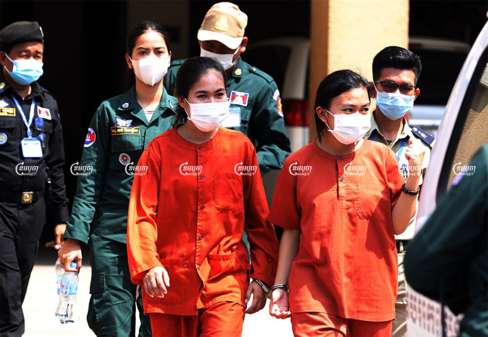 Mother Nature activists Phuon Keoreaksmey and Long Kunthea leave Phnom Penh Municipal Court after their verdicts, May 5, 2021. CamboJA/ Pring Samrang