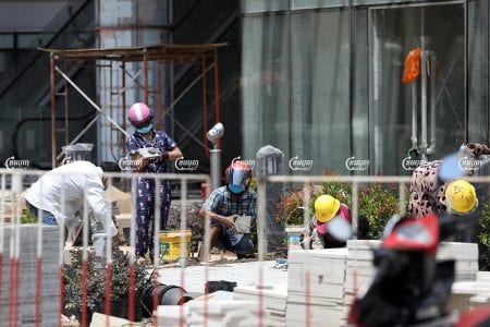 Workers work at a construction site in Phnom Penh, May 19, 2021. CamboJA/ Pring Samrang