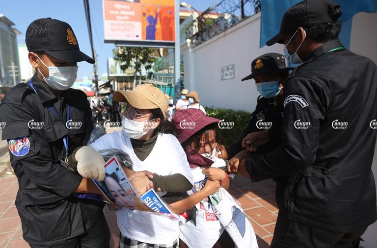 Authorities seized banners from the family members of activists from the forcibly dissolved CNRP as they submittes a petition to a UN office in Phnom Penh, June 4, 2021. CamboJA/ Pring Samrang