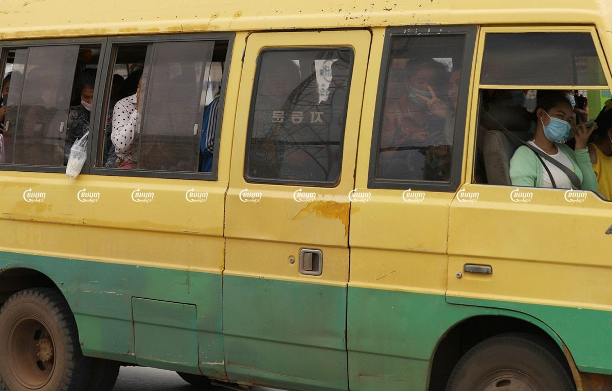 Garment workers travel to their factory in a crowded van ahead in Choam Chao1 commune, Pur Sen Chey district in Phnom Penh, June 10. CamboJA/ Pring Samrang
