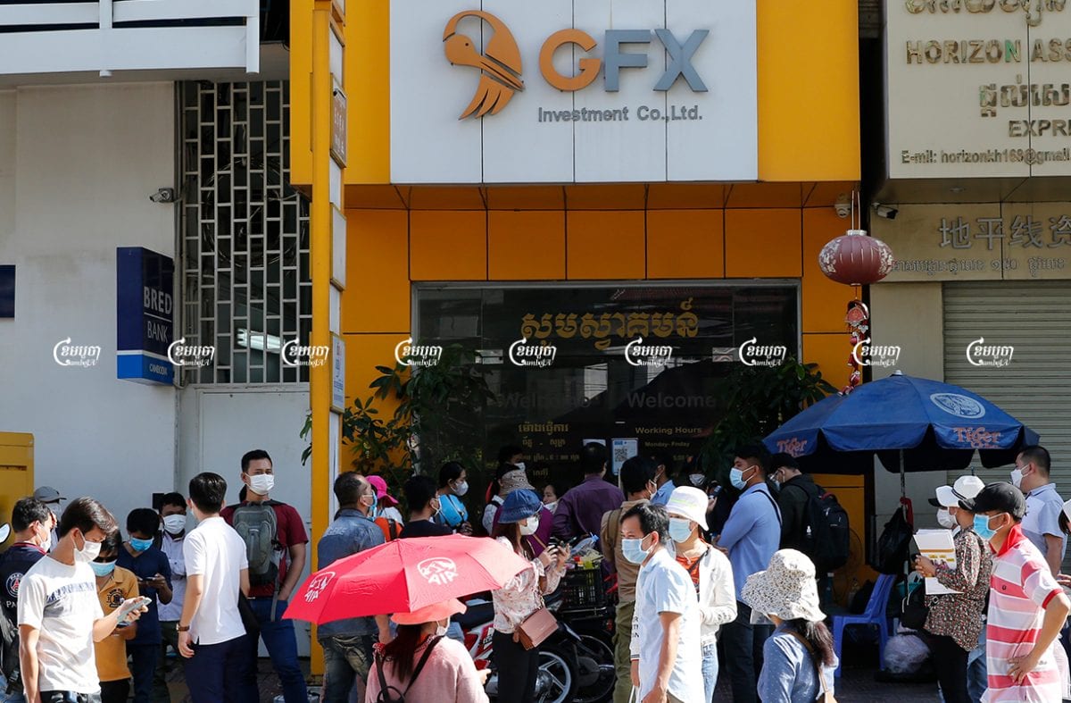 Investors gather in front of the GoldFX Investment Co., Ltd building in Phnom Penh to demand their money back after $27million was stolen from the investment fund, May 31, 2021. CamboJA/ Panha Chhorpoan