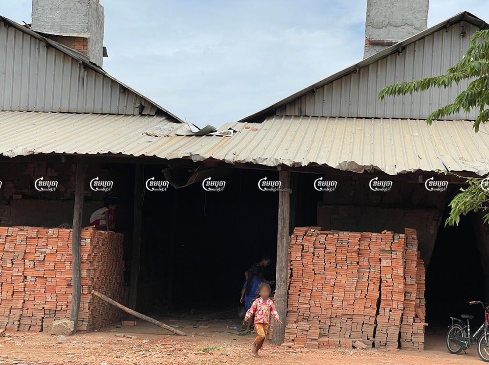 Children play at a brick kiln in Kandal province while their parents work making bricks, July 20. CamboJA/ Khuon Narim