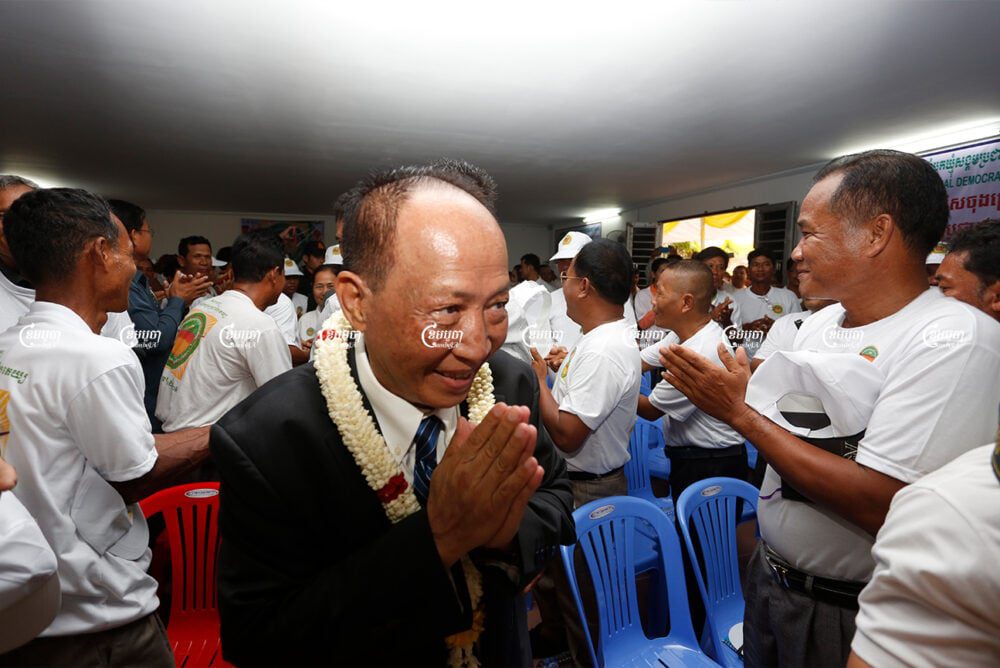 Mam Sonando, president of the Beehive Social Democratic Party, greets party members during a party congress in 2018. CamboAJ/ Panha Chhorpoan