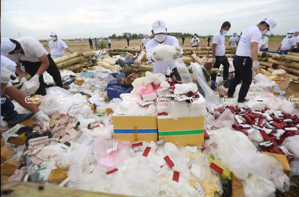 Officials prepare confiscated drugs for burning during a ceremony to mark the International Day against Drug Abuse and Illicit Trafficking in Phnom Penh, July 19, 2021. CamboJA/ Pring Samrang