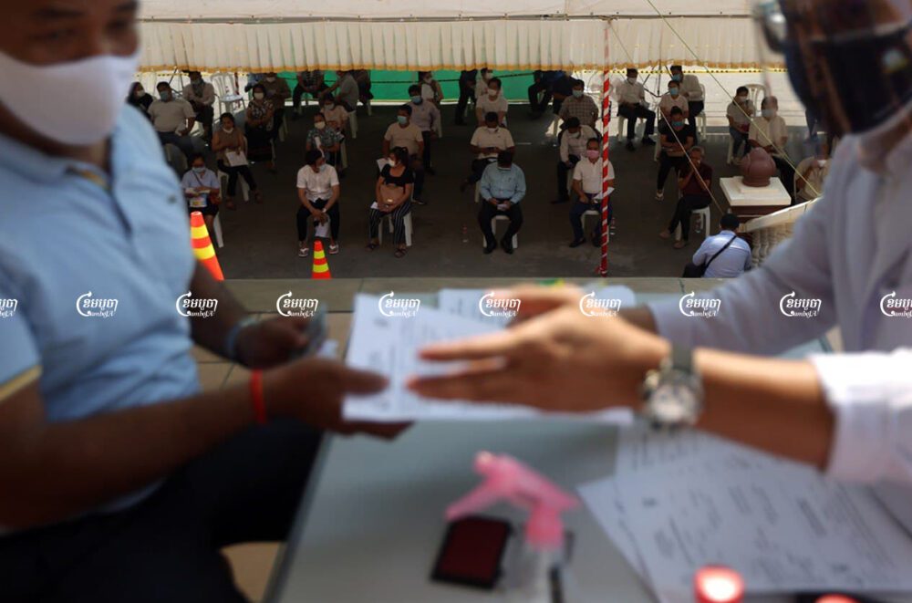 People wait to be vaccinated against COVID-19 in Phnom Penh. Picture taken on April 1, 2021. CamboJA/ Pring Samrang