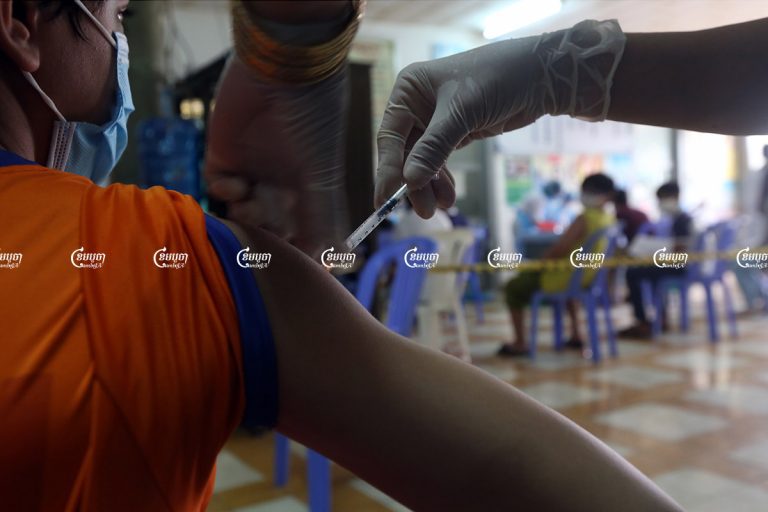 Children between the ages of 12 and 17 receive their first dose of Sinovac's Covid-19 vaccine in Phnom Penh, August 1, 2021. CamboJA/ Pring Samrang