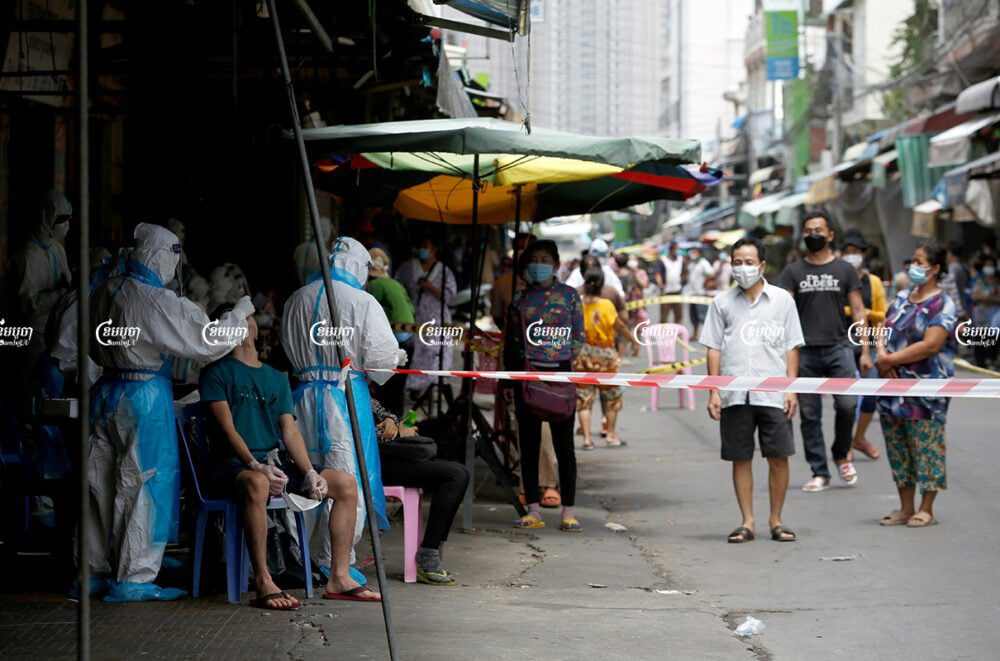 Health officials give Covid tests to residents in Phsar Touch village, Tuol Sangke 1 commune, Russei Keo district in Phnom Penh, which has recorded an outbreak of the Delta variant, August 2, 2021. CamboJA/ Panha Chhorpoan