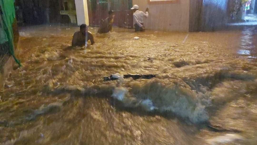 Residents of Muoy commune, Sihanoukville make their way through floodwaters, Picture taken on August 24. Supplied