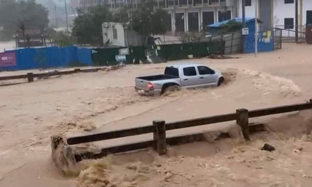 A truck drives through floodwaters in Sihanoukville. Picture taken on August 24. Supplied
