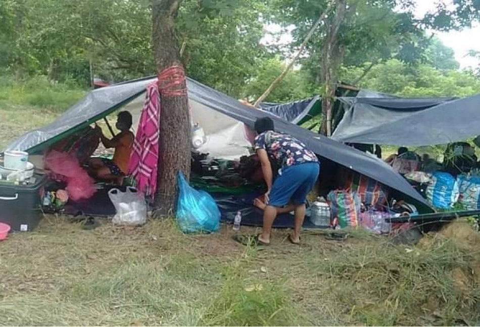 A group of workers arranges their home at the temporary campsite near the Thai-Cambodian border. Supplied