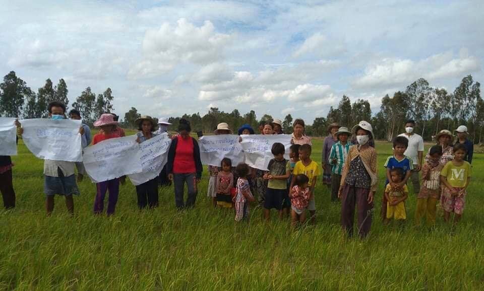 Villagers protesting on their farmland on Monday. The disputed land is within the boundary of a canal restoration project. Supplied