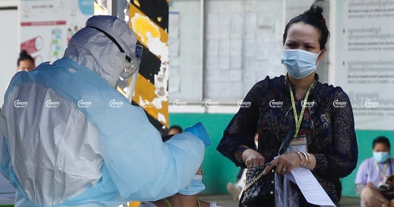 A health worker tests a garment worker for the Covid-19 at a factory in Phnom Penh. Picture taken April 15, 2021. CamboJA/ Panha Chhorpoan