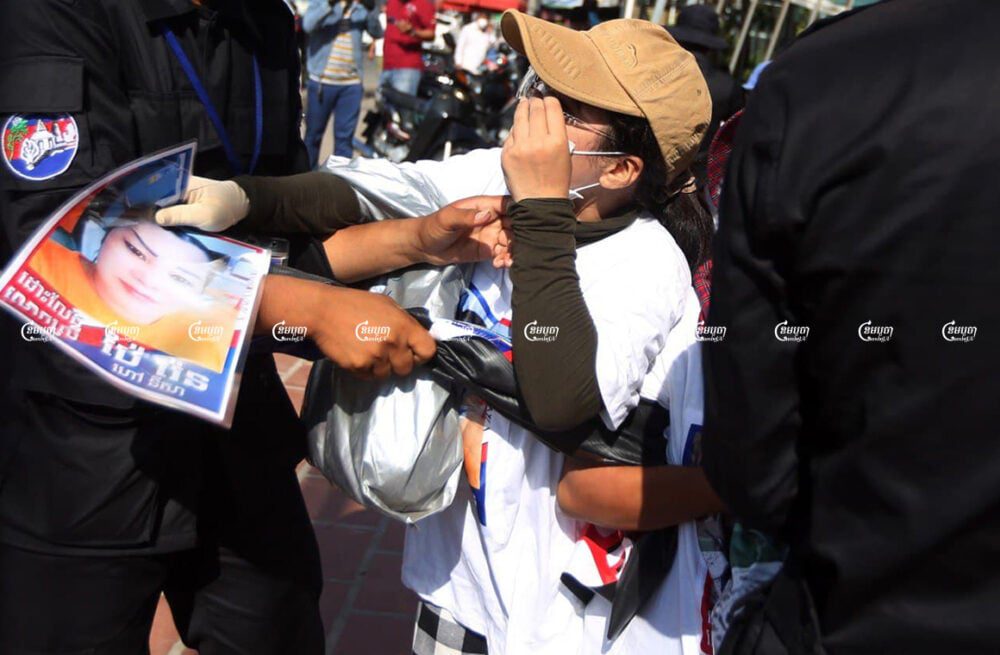 Authorities seized banners from the family members of activists from the forcibly dissolved CNRP as they submittes a petition to a UN office in Phnom Penh, June 4, 2021. CamboJA/ Pring Samrang