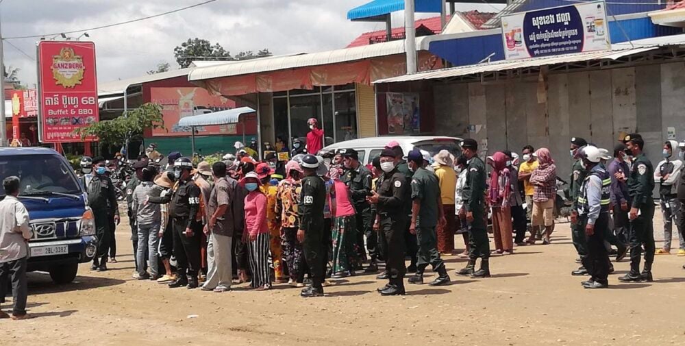 Police prevent villagers from protesting at National Road 2 amid a land dispute over the newly planned airport in Kandal Stung district on September 7, 2021. Photo Supplied