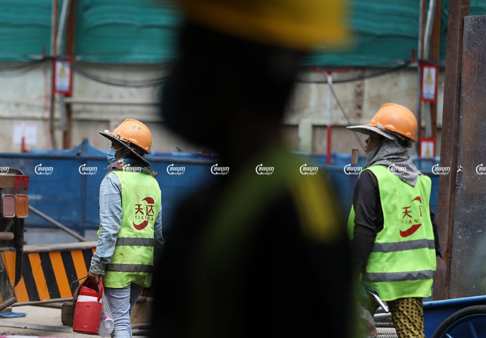 Laborers work at a construction site in Phnom Penh, Picture taken September 27, 2021. CamboJA/ Pring Samrang