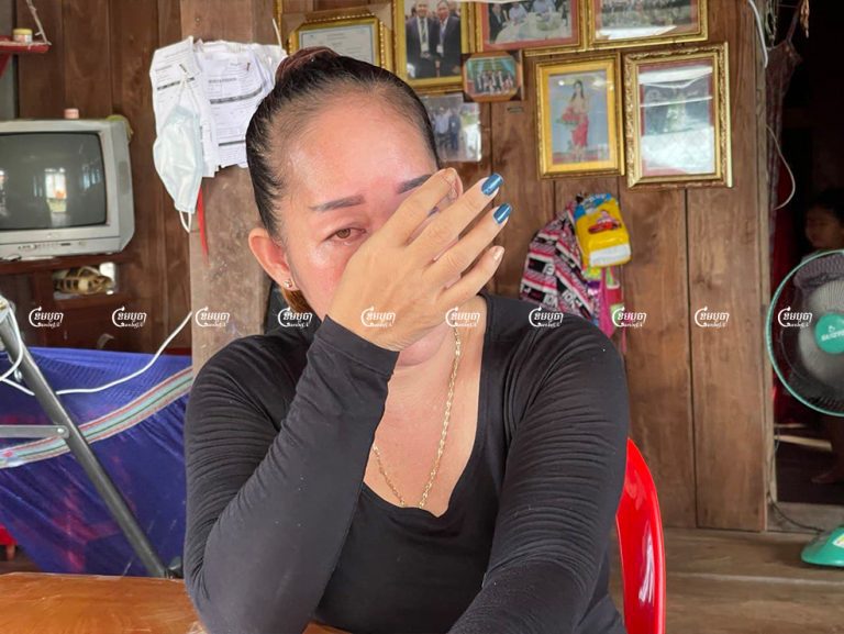 Yuon Chhiv’s wife Ouch Vanthan wipes away her tears during an interview at her house in Prey Kralorm village, Thmar Sar commune while talking about her husband's arrest. Photo taken on October 22. CamboJA/ Khuon Narim