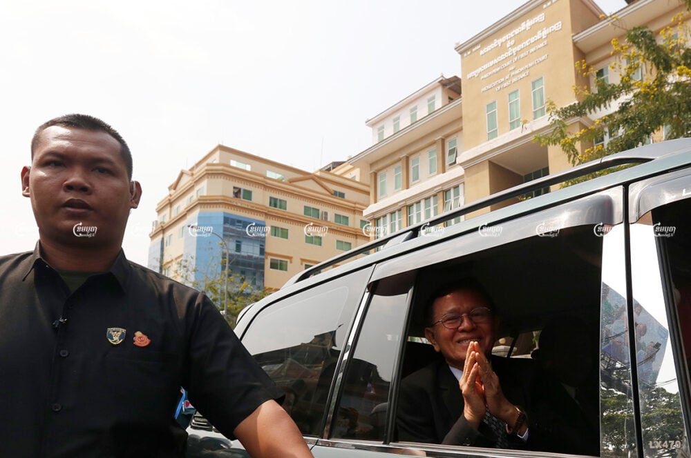 Former opposition leader Kem Sokha greets his supporters as he leaves the Phnom Penh Municipal Court. Picture taken January 16, 2020. CamboJA/ Pring Samrang