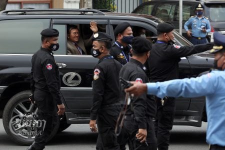 Kem Sokha waves to supporters while leaving Phnom Penh Municipal Court after his Tuesday hearing, January 25, 2022. CamboJA/ Pring Samrang