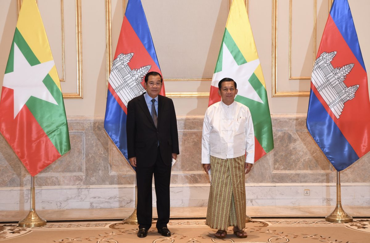 Prime Minister Hun Sen (L), is welcomed by Military leader Min Aung Hlaing during a meeting in Myanmar, January 7, 2022. CamboJA/ Hand out photo from An Khuon SamAun National Television of Cambodia