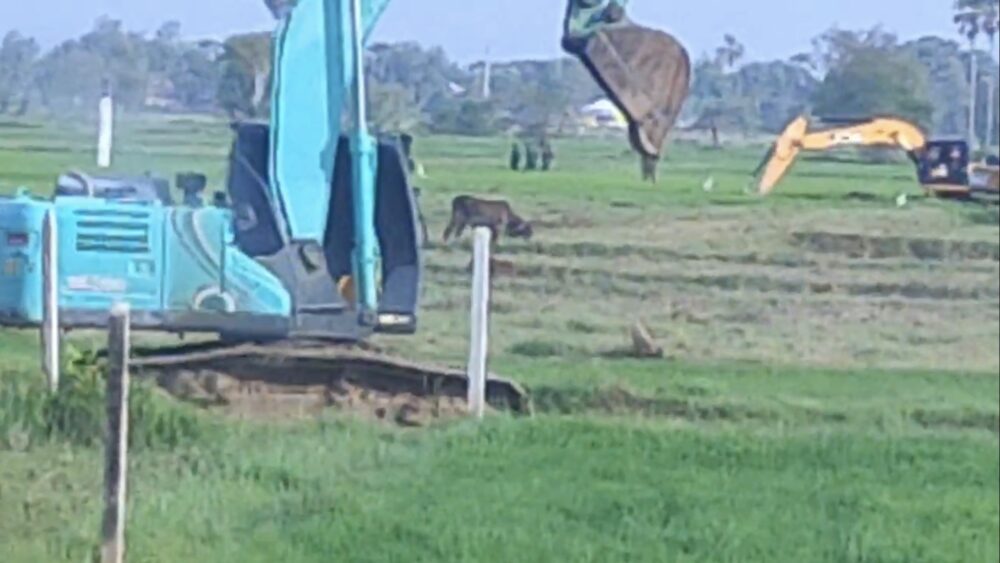 Excavators clear the rice fields of villagers to build the new mega airport in Kandal province. Photo taken on February 9, 2022.