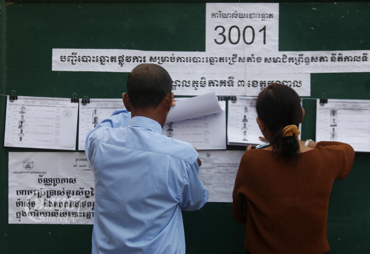 Commune counsellors check voter lists during a Senate election in Takhmao, Kandal province. Picture taken February 25, 2018. CamboJA/ Pring