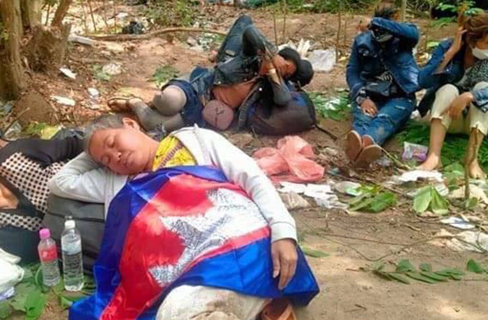 Sat Pha rests with migrant workers after arriving at the Thai border on April 17, 2022. Photo supplied