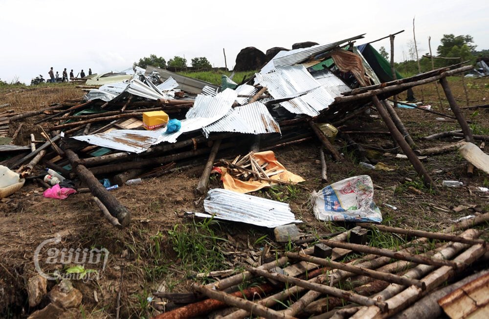 Villagers stand near the remains of their huts, which they say authorities demolished last week, Picture taken August 24, 2022. CamboJA/Pring Samrang