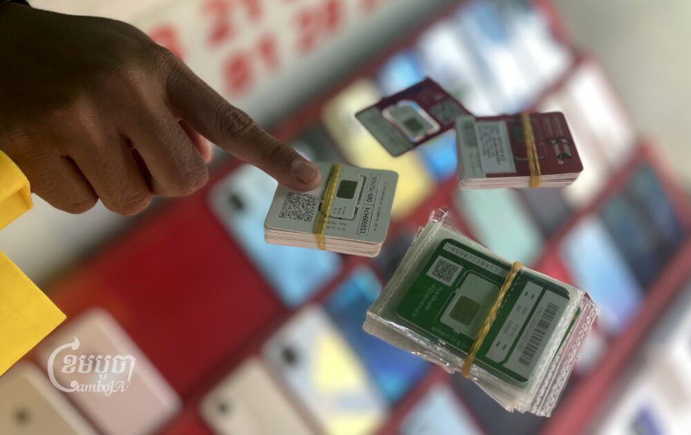 A vendor shows new SIM Cards for sale at a market in Phnom Penh on March 14, 2023. (CamboJA/Pring Samrang)