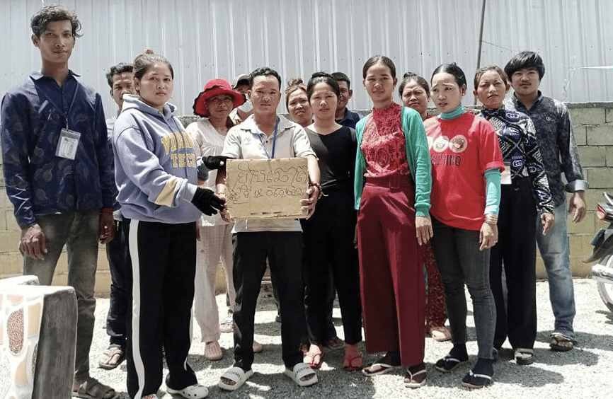Union leaders and their members hold a voting box after casting their votes for their union leaders at Cinlon factory on June 18, 2022. (Supplied)
