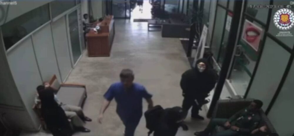 A screenshot from a video showing gunmen helping prisoner Chen Hsin Han escape from a dental clinic in Siem Reap province on August 17, 2023.