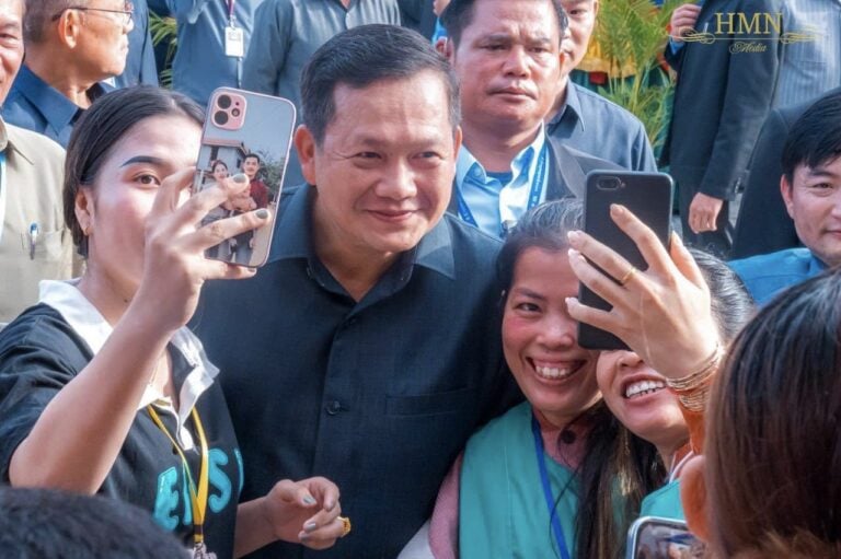 Prime Minister Hun Manet takes a photo with garment workers as he met nearly 20,000 workers in Phnom Penh's Pur Senchey district on August 29, 2023. (PM Hun Manet Facebook)