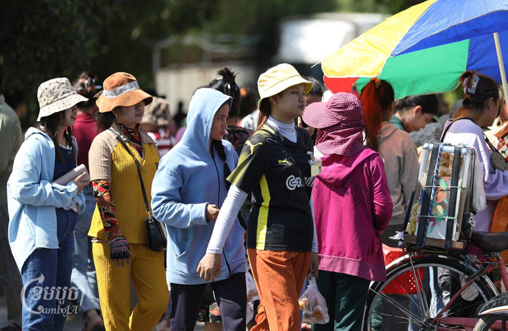 Garment workers leave the factory during their lunch break in Phnom Penh, January 4, 2024. (CamboJA/Pring Samrang)