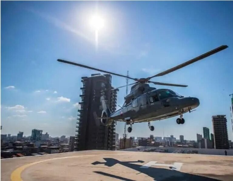 A helicopter lands at the top of the Ministry of National Defense building in 2021. (Ministry of National Defense’s Facebook)