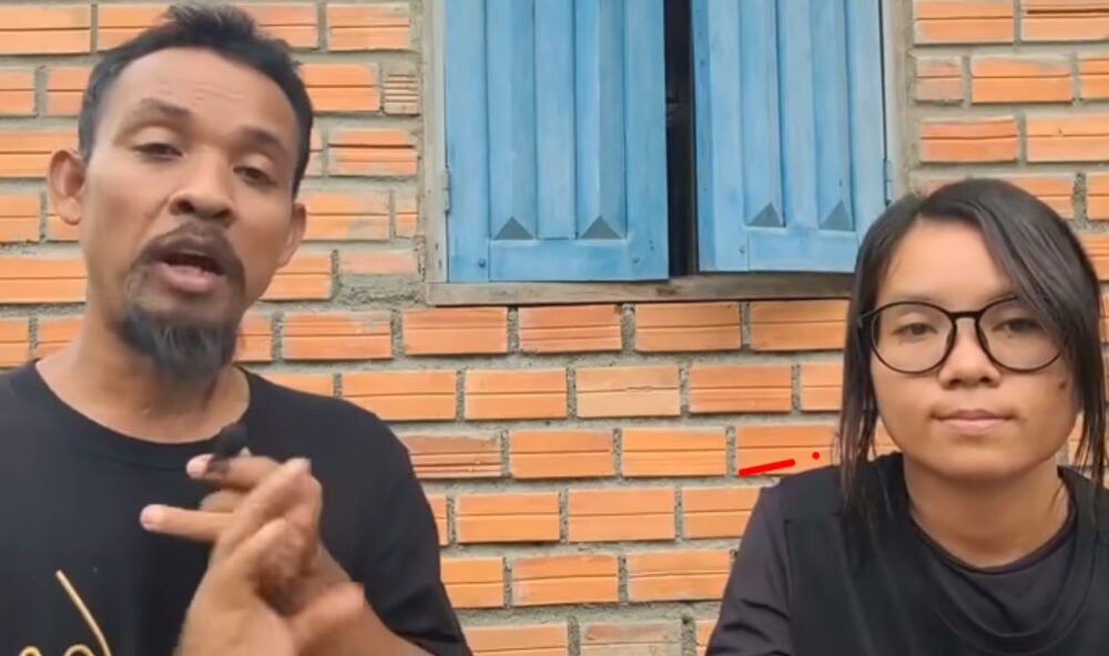 A photo screenshot of Srun Srorn and a colleague in a live video covering the CLV which later led to their arrest.