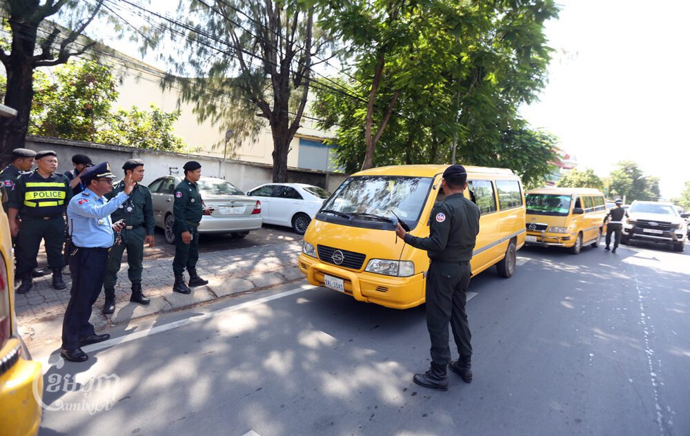 Police check vehicles entering Phnom Penh on a street in Kandal province to stop any anti-CLV-DTA demonstrations planned on August 18, 2024. (CamboJA/Pring Samrang)