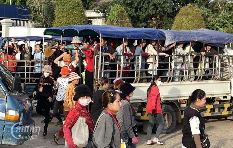 Garment workers ride in crowded trucks to a factory in the Kong Pisei district, Kampong Speu province on July 27, 2024. (CamboJA/ Pring Samrang)